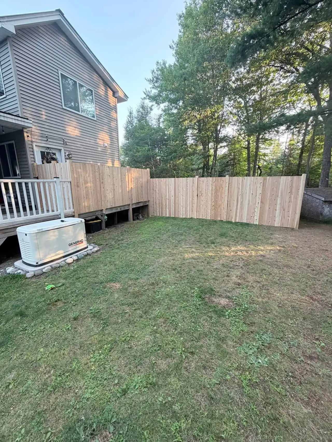 Wood privacy fence along a residential yard